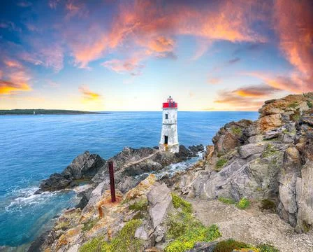 Breathtaking view of sunset  over Capo Ferro Lighthouse. Foto stock