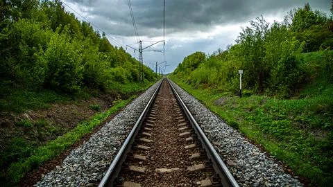 Breathtaking view of train tracks extending towards distant horizon, offering Stock Photos