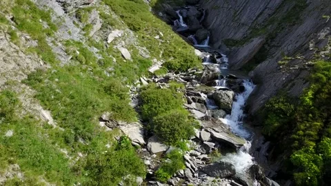 Breathtaking view: a winding stream flowing through rocky terrain, Ubaye, France Stock Footage 301402172