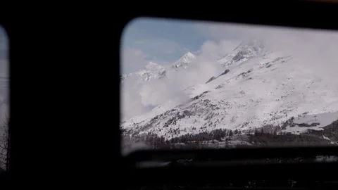 Breathtaking Views of Swiss Mountains from a Train Window Stock Footage 287380211