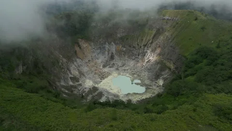 Breathtaking Volcanic Lake with Clouds Mount Mahawu Aerial Shot 動画素材 339858366