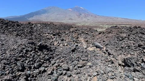 Breathtaking Volcanic Landscape with Dramatic Lava Rocks Set Against a Clear Stock Photos