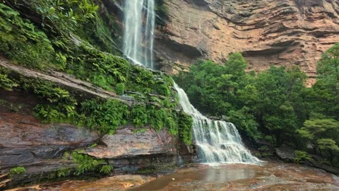 A breathtaking waterfall cascades down a cliff in Blue Mountains Katoomba Stock Footage 306124107