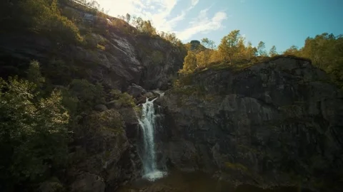 Breathtaking Waterfall Cascading Over Rock Formations Stock Footage 323301633