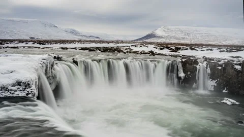 Breathtaking waterfall in snowy mountains Stock Footage 196622765