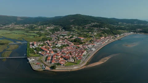 Breathtaking wide-angle aerial drone panorama of the coastal town of Caminha Видео 336282227