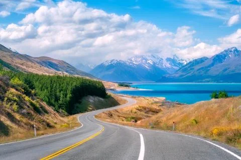 Breathtaking winding road along Lake Pukaki in Mount Cook NP, New Zealand Stock Photos