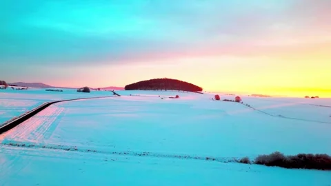 A breathtaking winter landscape at sunset with a long winding road. Stock-Footage 341390591