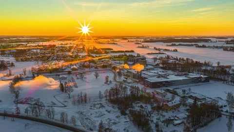 Breathtaking Winter Sunset Over Snow-Covered Town Captured in Timelapse Stock Footage 331198615
