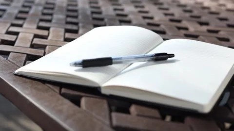 Breeze blowing notebook - slow Stock Footage 324283189