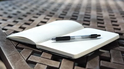 Breeze blowing open notebook Stock Footage 324283213