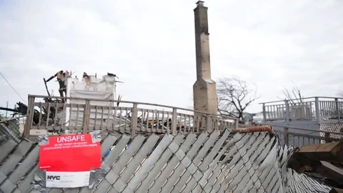 The Breezy Point area of Queens New York is devastated by Hurricane Sandy. Stock Footage 74800246