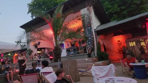 Bregenz, Austria - 19 August 2023: Outdoor evening bar with palm trees Stock-Footage 339075406