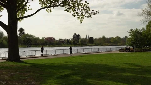 Bremen- 4k tracking shot of runner at Osterdeich along Weser Stock Footage 194650696