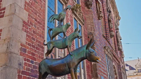 Bremen, Germany - 19.08.2025: Bremen Town Musicians statue in the historic Stock Footage 320843092