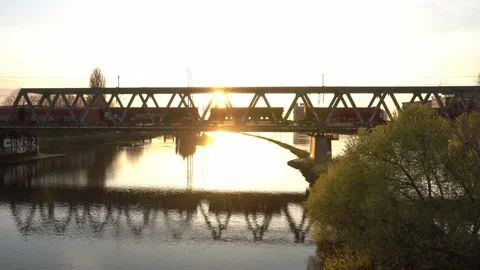 Bremen, Germany - freight train passing a bridge  over Weser during golden hour Video stock 194543914