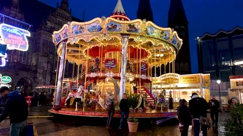 Bremen, Germany1: Old style carousel moving on square in city. Stock Footage 232185187