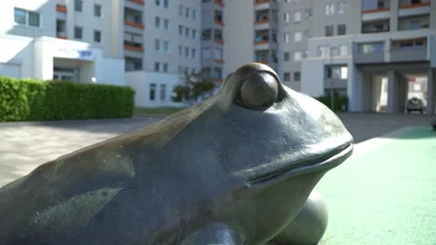 Bremen Tenever - statue of frog in yard of a social housing building, 4k Stock Footage 195985599