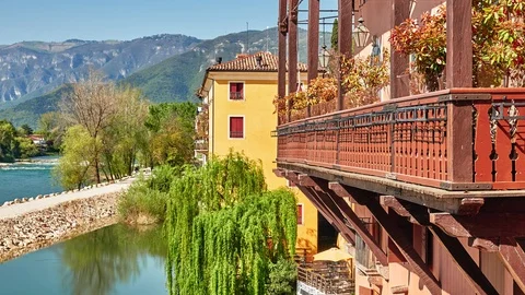 Brenta River and ancient stone buildings in Bassano del Grappa, Vicenza provi Stock Footage 128355592