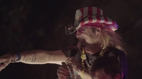Bret Michaels (Poison) throws beads in Mardi Gras parade, CU Stock Footage
