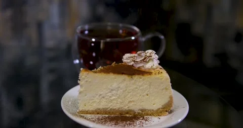 Brew black tea Serving cheesecake slice on plate. Classical new york cheesecake Stock Footage 291641658