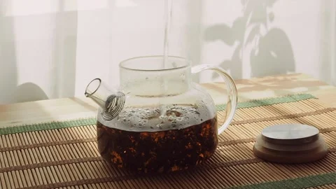 Brew fragrant black tea in a glass transparent teapot. Stock Footage 200071203