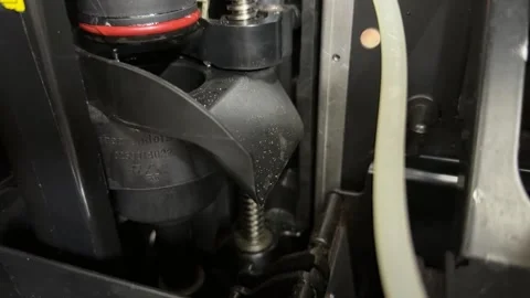 Brew unit inside coffee vending machine with connected hoses in close up, Stock Footage 337117068
