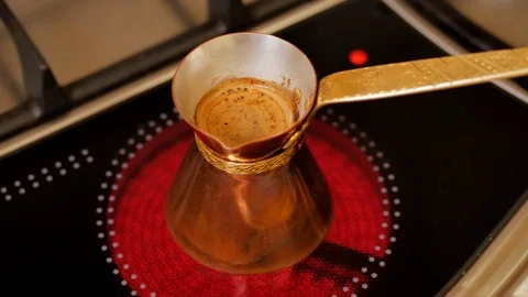 Brewed coffee is in pots on the stove 스톡 동영상 123784986