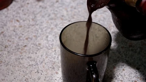 Brewed coffee poured into the Cup Video stock 80217342