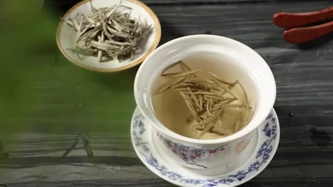 Brewed Fuding White Tea in Ceramic Cup Moody Still Life Stock Footage 341668662
