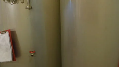 Brewer with malt on the background of the brewery Stock-Footage 101429654