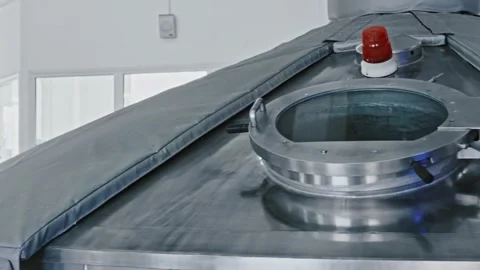 Brewery fermentation tank hatch opening automatically 스톡 동영상 337411012
