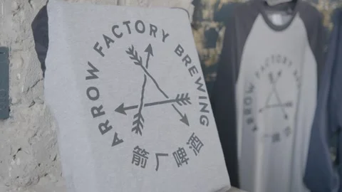 Brewery Logo Shirts on Display in Beijing Interior for Food and Drink Context Stock Footage 345755869