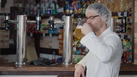 Brewery Worker Drinks Mug Of Refreshing Beer Alcoholic Beverage In Bar Stock Footage 288996978
