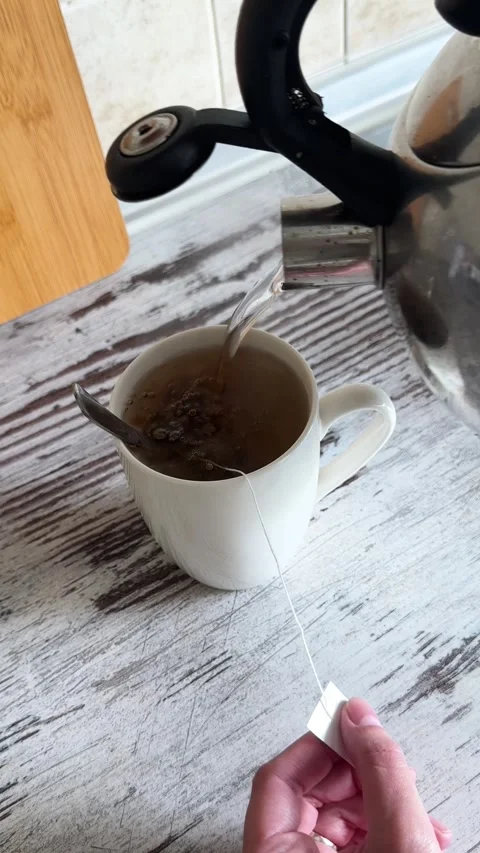 Brewing and Stirring Herbal Tea Close Up Stock-Footage 340340933