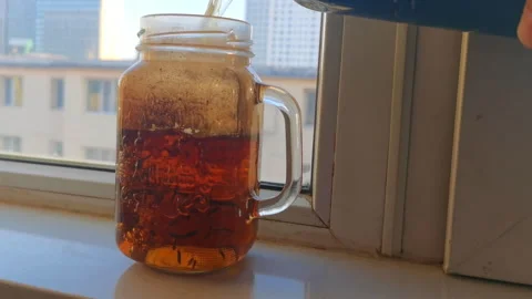 Brewing Black Tea in Traditional Old Teacup Stock Footage 333618598