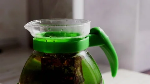 Brewing black tea in a transparent teapot. Slow motion. Stock Footage 49123007