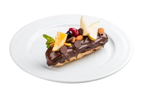 Brewing cake. Eclair with nuts on white background Stock Photos