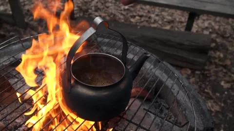 Brewing coffe over camp fire Stock Footage 149521062