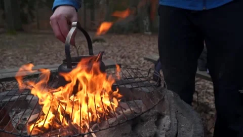 Brewing coffe over camp fire Stock Footage 149521065