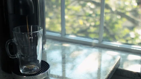 Brewing Coffee In A Clear Glass By A Window Stock Footage 116674730
