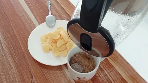 Brewing coffee in a cup. Stock Footage 322508225