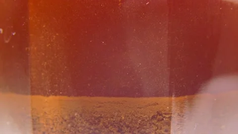 Brewing coffee in a cup - particles slowly sink Stockbeeldmateriaal 139355287
