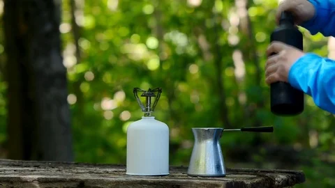 Brewing coffee in a green forest. Stock Footage 79212564