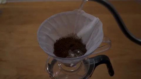 Brewing coffee by hand slow motion Stock Footage 146947589