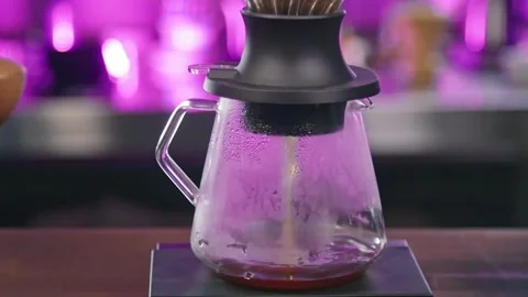 Brewing coffee in an immersion dripper slow motion Stock Footage 188092827
