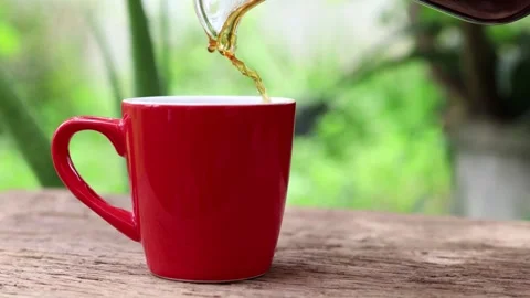 Brewing coffee jar close up from coffee maker hand fresh morning routine in 4k Stock Footage 336585300