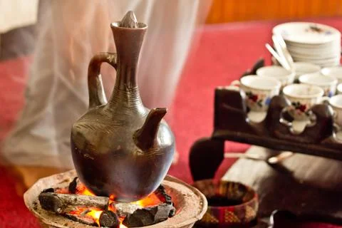 Brewing coffee with Jebena using coal Stock Photos