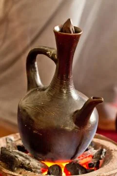 Brewing coffee with Jebena using coal 스톡 사진