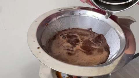 Brewing Coffee In A Metal Filter Dripper Close Up Video stock 313542601